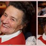 Lachende Bäuerin mit traditioneller Kleidung beim Jahrtag im Gasthof Schörhof.